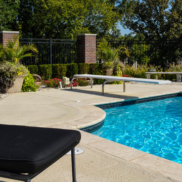 Grecian swimming pool with L, diving board and hot tub