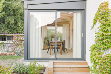 Idées déco pour une véranda contemporaine de taille moyenne.