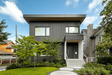 Inspiration for a mid-sized contemporary partial sun backyard concrete paver and wood fence landscaping in Vancouver for summer.