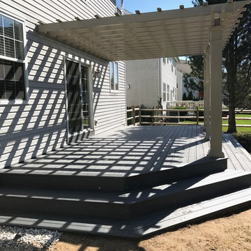 Backyard Deck With Corner-Wrapped Steps and Pergola