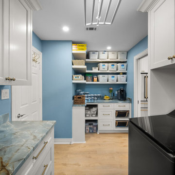 Functional laundry room and walk-in pantry combo with custom storage shelving