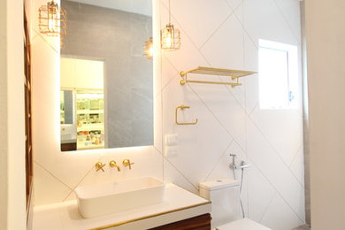 Example of a mid-sized minimalist master white tile and porcelain tile cement tile floor and gray floor walk-in shower design in Other with glass-front cabinets, medium tone wood cabinets, a bidet, white walls, a vessel sink, tile countertops and a hinged shower door