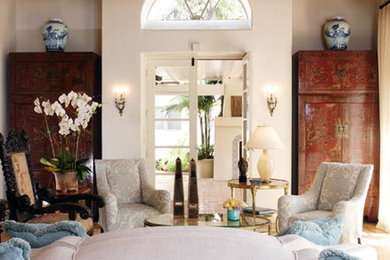 Inspiration for a large mediterranean formal and enclosed terra-cotta tile and multicolored floor living room remodel in San Diego with white walls, a standard fireplace, a plaster fireplace and no tv