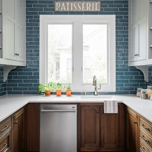 Photo of a mid-sized transitional u-shaped kitchen pantry in Atlanta with an undermount sink, flat-panel cabinets, grey cabinets, quartz benchtops, blue splashback, ceramic splashback, stainless steel appliances, brick floors, no island, red floor and white benchtop.