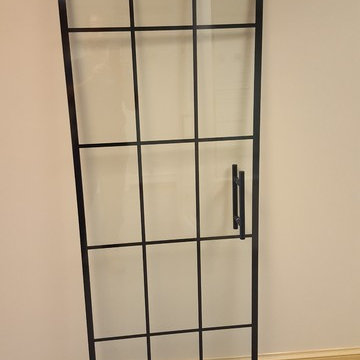 black frameless shower door with mullions