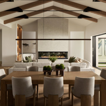 Open Living & Dining Room with Luxury Double Sided Fireplace and Venetian plaste