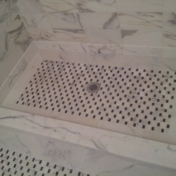 Marble Look Shower Stall with Black and White Mosaic Floor