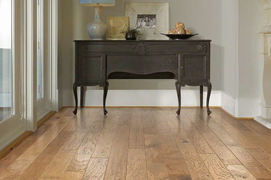 Mid-sized ornate dark wood floor and brown floor hallway photo in Other with gray walls