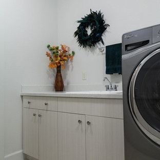 Design ideas for a medium sized contemporary galley separated utility room in Other with a built-in sink, flat-panel cabinets, light wood cabinets, terrazzo worktops, white walls, ceramic flooring, a side by side washer and dryer and beige floors.