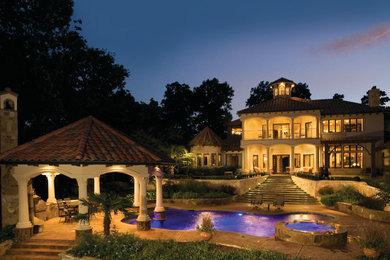 Inspiration for a mediterranean custom-shaped pool remodel in Dallas