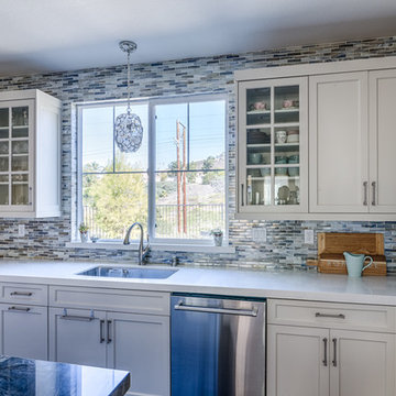 A Crystal & Capize shell chandelier adds a hint of glam over the sink.