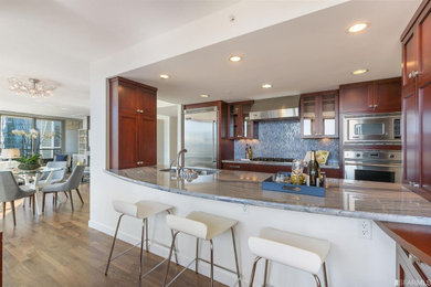 Open concept kitchen - mid-sized contemporary galley dark wood floor and brown floor open concept kitchen idea in San Francisco with shaker cabinets, dark wood cabinets, blue backsplash, a peninsula, a double-bowl sink and stainless steel appliances