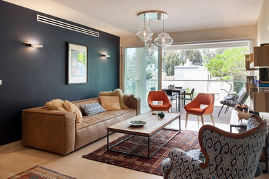 Inspiration for a small mediterranean open concept porcelain tile living room remodel in Tel Aviv with beige walls and a wall-mounted tv