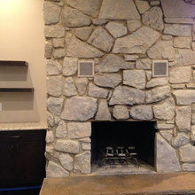 White washed stone fireplace