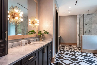 Transitional marble tile bathroom photo in Orlando with black cabinets, marble countertops and a hinged shower door