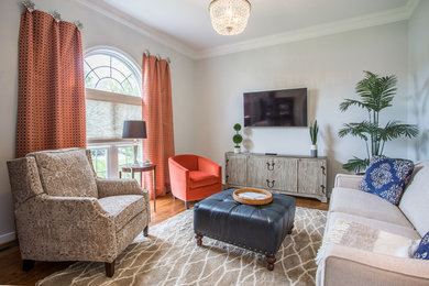 Living room - mid-sized transitional formal and open concept light wood floor and brown floor living room idea in Richmond with a wall-mounted tv, gray walls and no fireplace