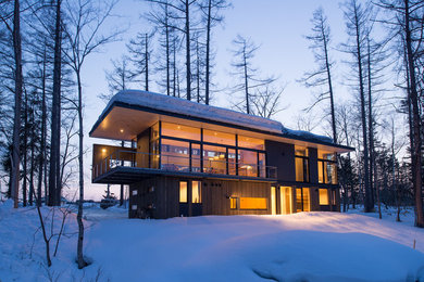 Example of a mountain style gray two-story mixed siding exterior home design in Sapporo