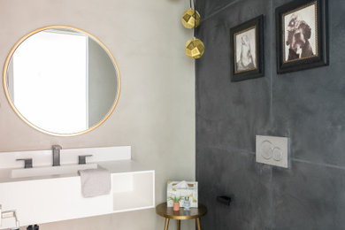 This is an example of a bathroom in Los Angeles with grey tiles and white worktops.