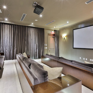 Home theater - large transitional enclosed carpeted and beige floor home theater idea in Toronto with beige walls and a projector screen