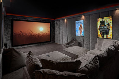 Photo of a medium sized modern enclosed home cinema in Gloucestershire with grey walls, carpet, a projector screen, grey floors and feature lighting.