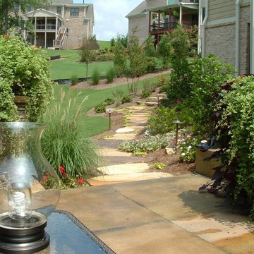 Fieldstone stepping stones and Concrete terrace with pots