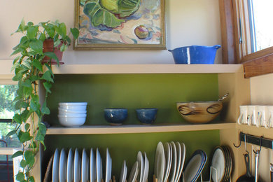Example of a mid-sized transitional u-shaped open concept kitchen design in Boston with shaker cabinets, light wood cabinets, granite countertops, beige backsplash, white appliances and an island