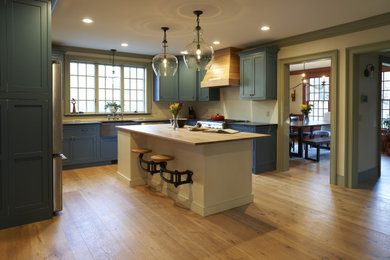 Country light wood floor and beige floor kitchen photo in Boston