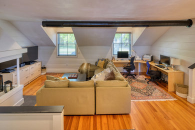Mid-sized transitional enclosed medium tone wood floor family room photo in Other with a corner fireplace, a plaster fireplace and a tv stand
