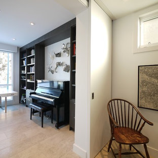 Inspiration for a medium sized modern study in Calgary with white walls, travertine flooring and a freestanding desk.