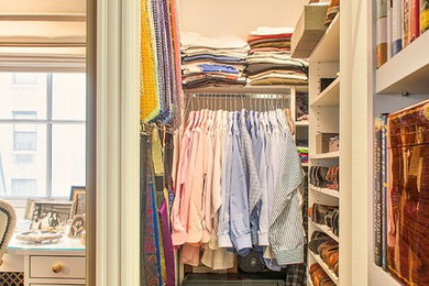 Walk-in closet - small traditional men's medium tone wood floor walk-in closet idea in Orange County with open cabinets and white cabinets