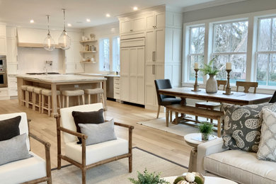 Inspiration for a mid-sized transitional light wood floor and beige floor kitchen/dining room combo remodel in Boston with gray walls and no fireplace