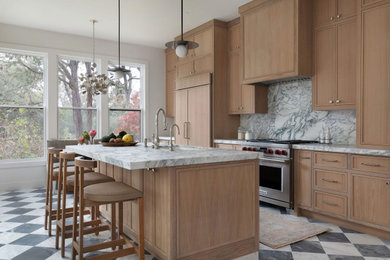 Transitional galley multicolored floor kitchen photo in Austin with an undermount sink, shaker cabinets, medium tone wood cabinets, gray backsplash, stone slab backsplash, stainless steel appliances, an island and gray countertops