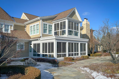 Example of a minimalist sunroom design in Chicago