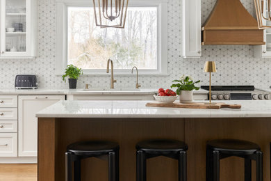Eat-in kitchen - large transitional single-wall medium tone wood floor and beige floor eat-in kitchen idea in Toronto with an undermount sink, raised-panel cabinets, quartzite countertops, white backsplash, porcelain backsplash, colored appliances, an island and white countertops