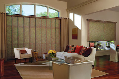 Living room - contemporary living room idea in Other with beige walls