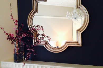 Silver mirror above fireplace mantel