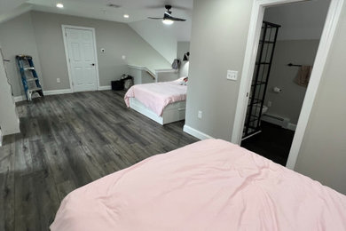 Inspiration for a huge timeless look-out vinyl floor and gray floor basement remodel in Philadelphia with gray walls