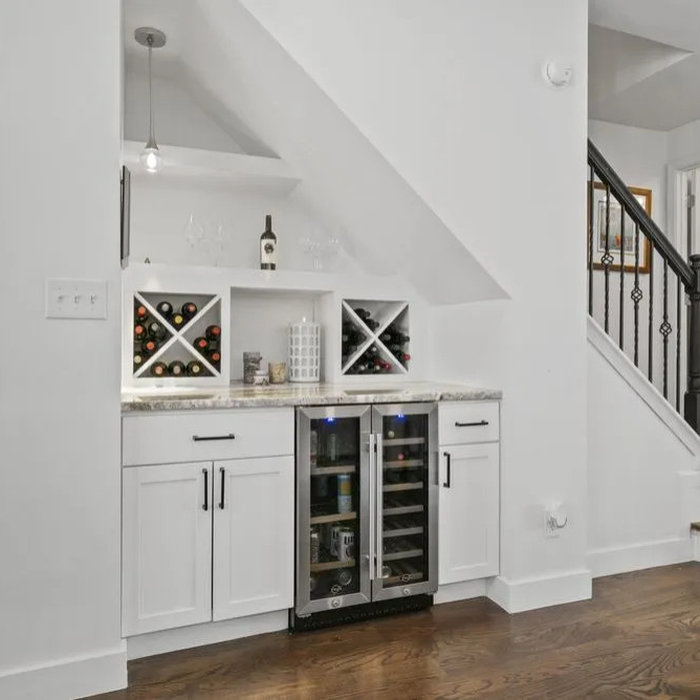Built-in wine bar beneath stairs