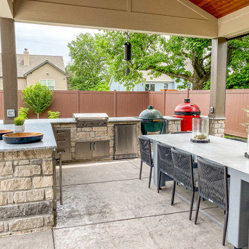 Pool-Side Covered Patio with a Fireplace and Outdoor Kitchen