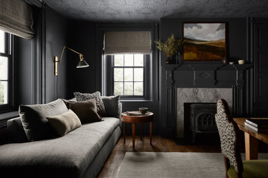 Inspiration for a transitional freestanding desk dark wood floor and brown floor home office remodel in Philadelphia with gray walls, a standard fireplace and a stone fireplace