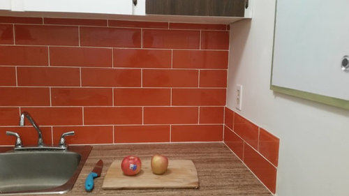 orange glass tile backsplash