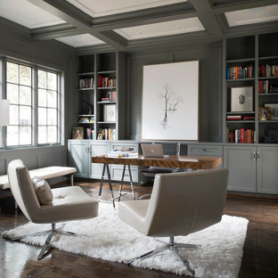 Design ideas for a modern study in Dallas with grey walls, dark hardwood flooring and a freestanding desk.