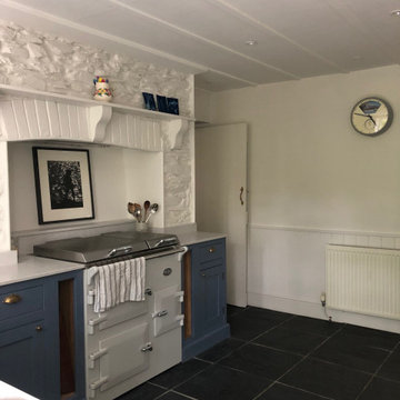 Beautiful blue hand painted country cottage kitchen with glazed cabinet