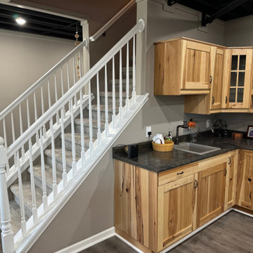 Transitional Basement With Under-Stair Wet Bar