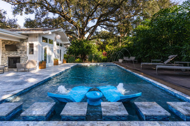 Inspiration for a mid-sized 1960s backyard concrete paver and rectangular pool landscaping remodel in Tampa