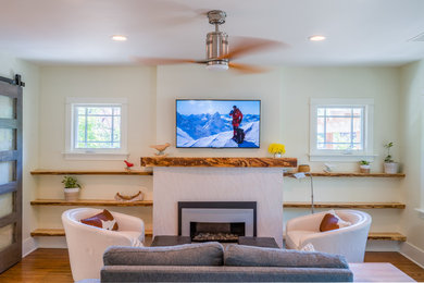 Living room - mid-sized transitional light wood floor living room idea in Denver with white walls, a standard fireplace, a tile fireplace and a wall-mounted tv
