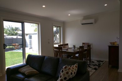 This is an example of a modern family room in Adelaide.