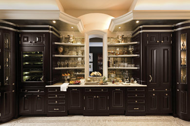 Inspiration for a large traditional u-shaped separate kitchen in Baltimore with an undermount sink, raised-panel cabinets, black cabinets, no island, beige floor and white benchtop.