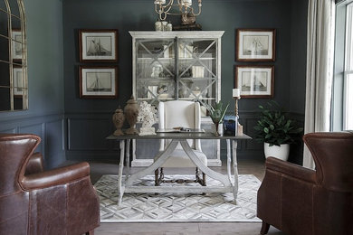 Mid-sized transitional freestanding desk vinyl floor and gray floor home office photo in Jacksonville with gray walls