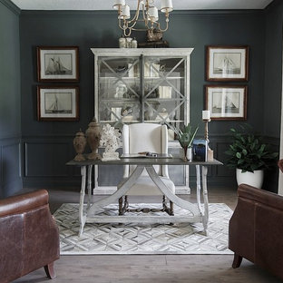 This is an example of a mid-sized transitional home office in Jacksonville with grey walls, vinyl floors, no fireplace, a freestanding desk and grey floor.